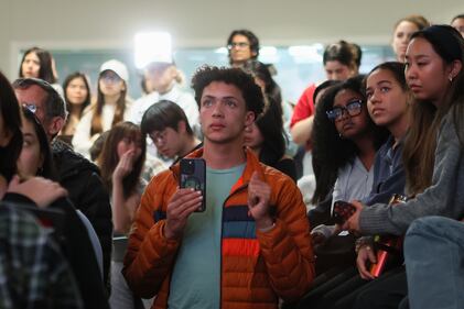 DESCRIBE THE IMAGE FOR ACCESSIBILITY, EXAMPLE: Photo of a chef putting red sauce onto an omelette.