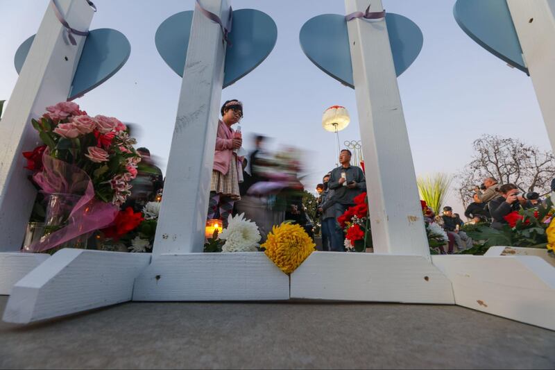 Photographs of a vigil outside the Monterey Park civic center held for the victims of the Monterey Park mass shooting.