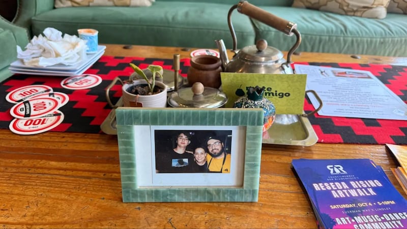 Photo of a table with a framed photo on it.