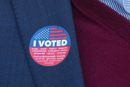 Faculty members Ron Galperin proudly displays their "I Voted" stickers on USC's campus.