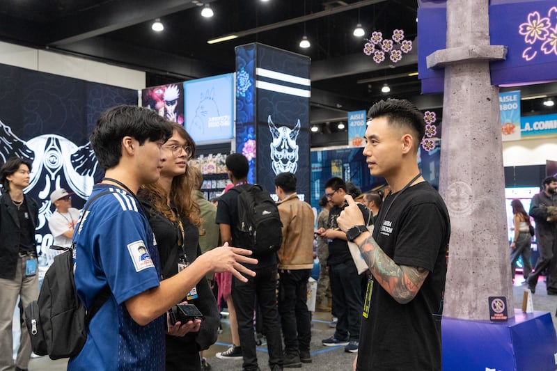 Photo of Johnny Chang, founder of Otaku Collectives, taking an interview with Aaron Ogawa, co-editor of elevASIAN.