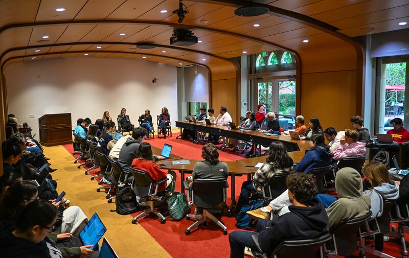 DESCRIBE THE IMAGE FOR ACCESSIBILITY, EXAMPLE: Photo of a chef putting red sauce onto an omelette.