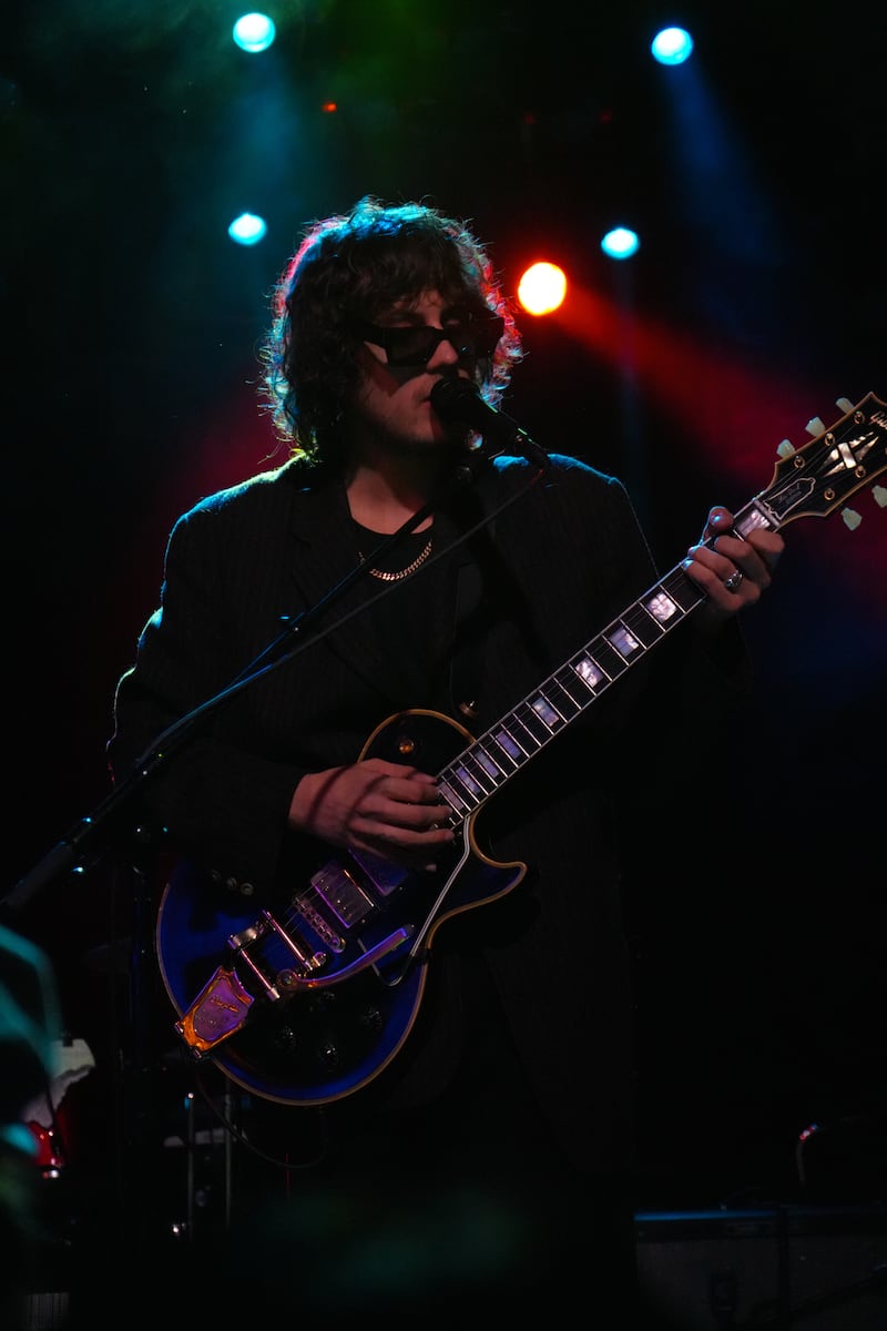 DESCRIBE THE IMAGE FOR ACCESSIBILITY, EXAMPLE: Photo of a chef putting red sauce onto an omelette.