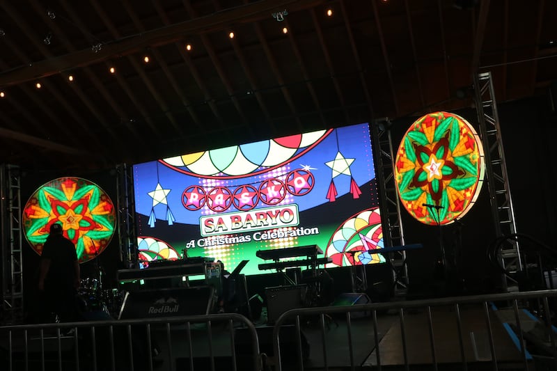 Dark stage with colorful signs and graphics