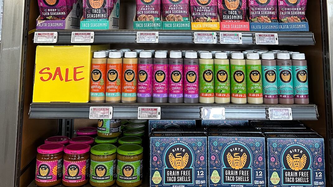 DESCRIBE THE IMAGE FOR ACCESSIBILITY, EXAMPLE: Photo of a chef putting red sauce onto an omelette.