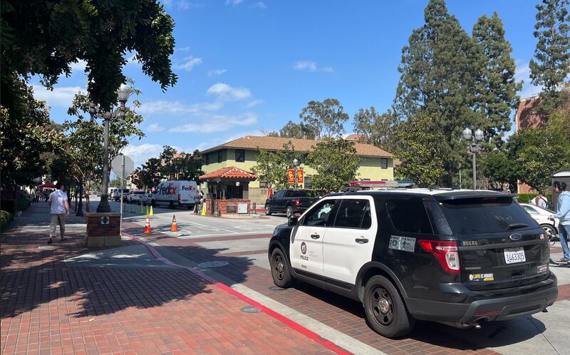 An LAPD police van is parked on USC's campus.