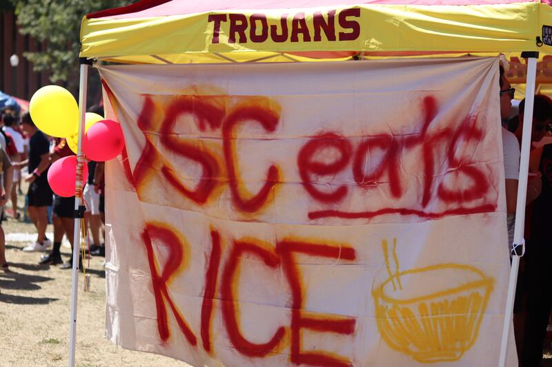 Fans pitched tents and created signs at the tailgate for pregame festivities.
