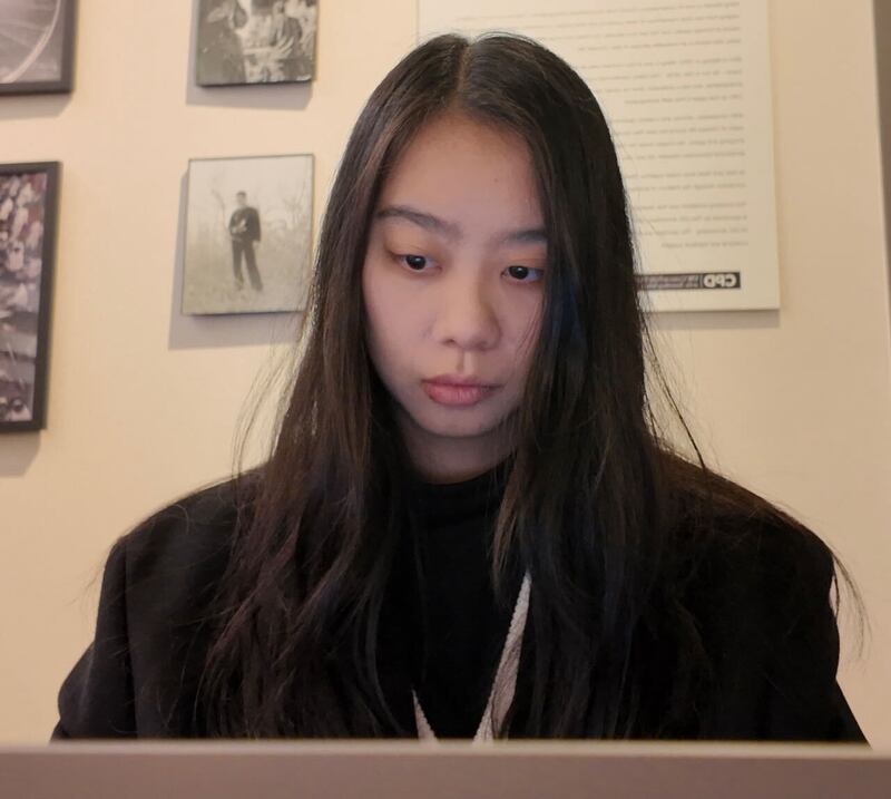Photo of a girl sitting in front of a computer