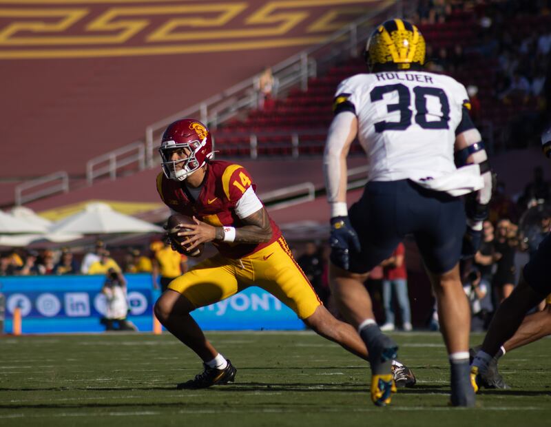Jayden Maiava runs the ball.