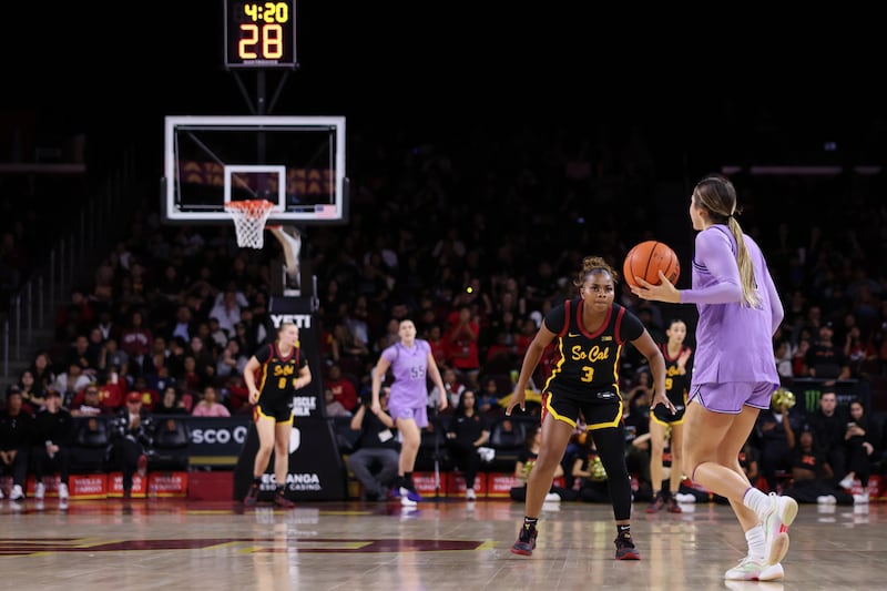 Londynn Jones (3) guards a Washington player near midcourt at Galen Center.