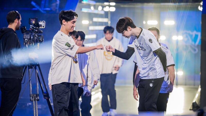 Photo of player Umti and Levi fist bumping before the match.