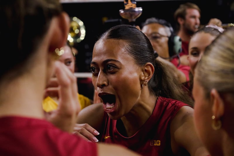 Close up shot of Faumuina yelling in her teammates' faces in a huddle.