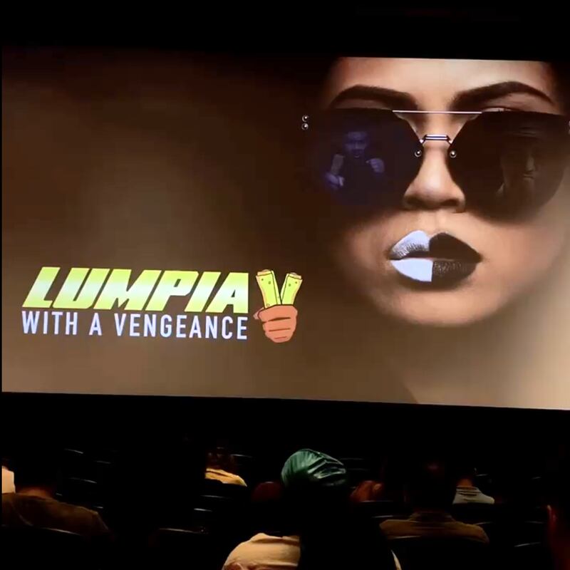 The movie poster for "Lumpia with a Vengeance," where a character where sunglasses and black and white lipstick.