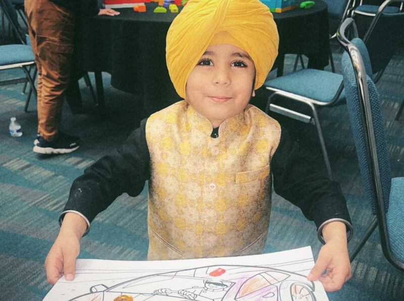 DESCRIBE THE IMAGE FOR ACCESSIBILITY, EXAMPLE: Photo of a chef putting red sauce onto an omelette.