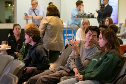 During a break students read to MSNBC's coverage of the polling for the democratic presidential primary.