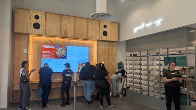 Sweetgreen at the USC Village features ordering kiosks and shelves for completed orders.