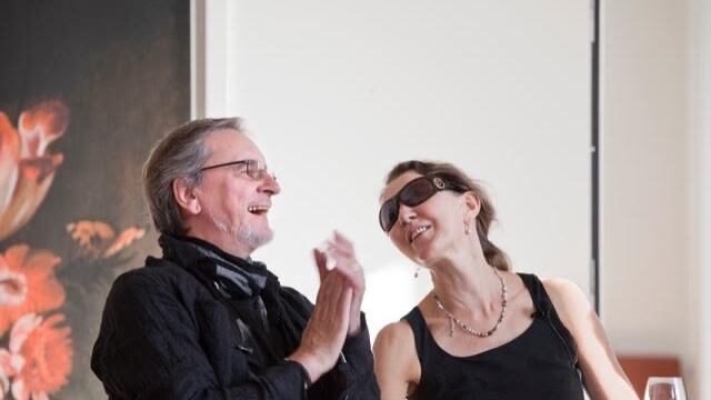 DESCRIBE THE IMAGE FOR ACCESSIBILITY, EXAMPLE: Photo of a chef putting red sauce onto an omelette.