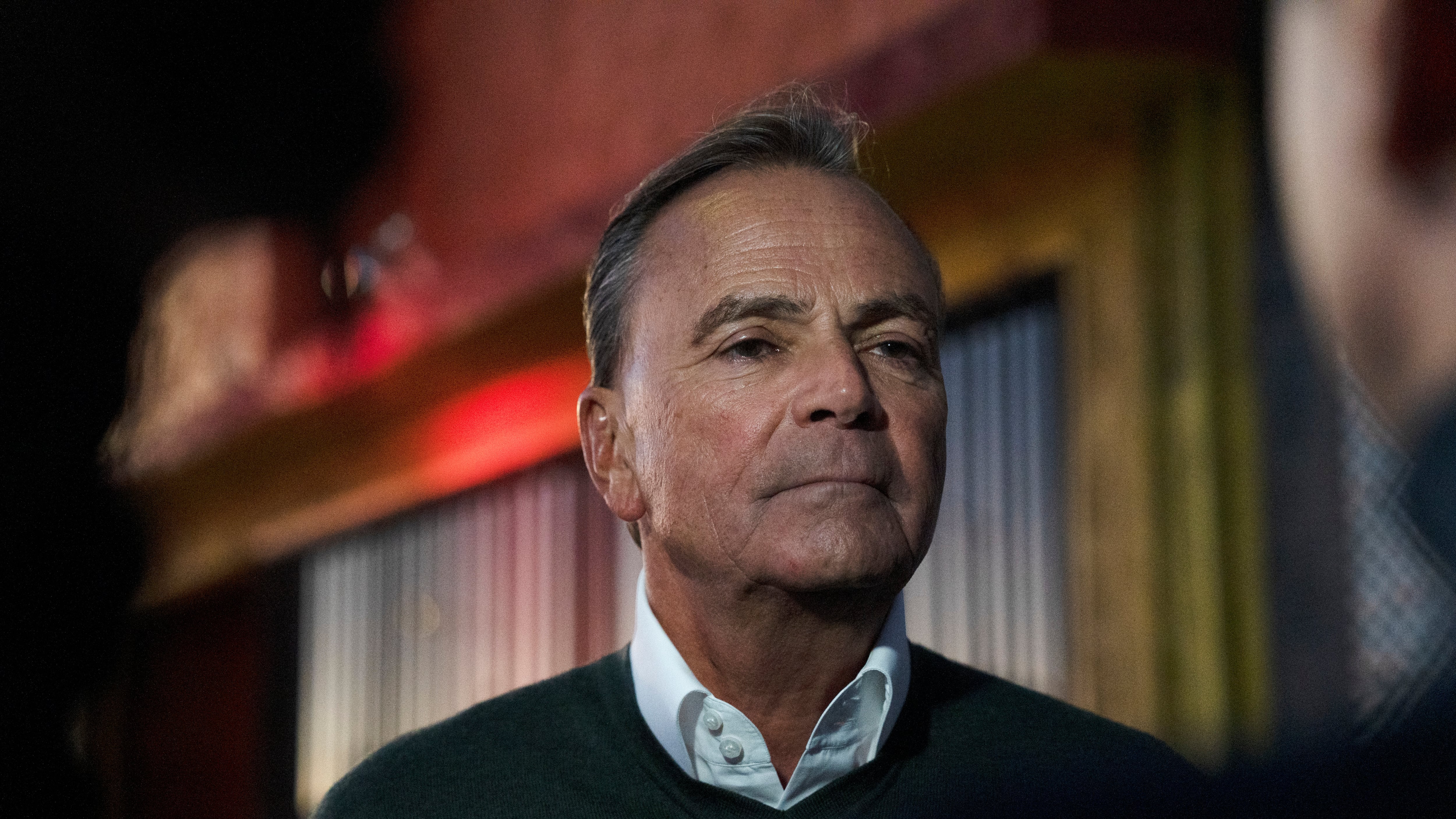 Rick Caruso talks to reporters in front of Salon Princesita in Watts on Nov. 2, 2022.