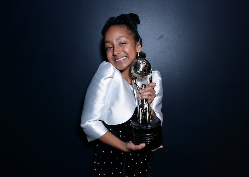 Mila Davis Kent holding her NAACP Image Award. Photo Courtesy of (Getty Images for NAACP)
.