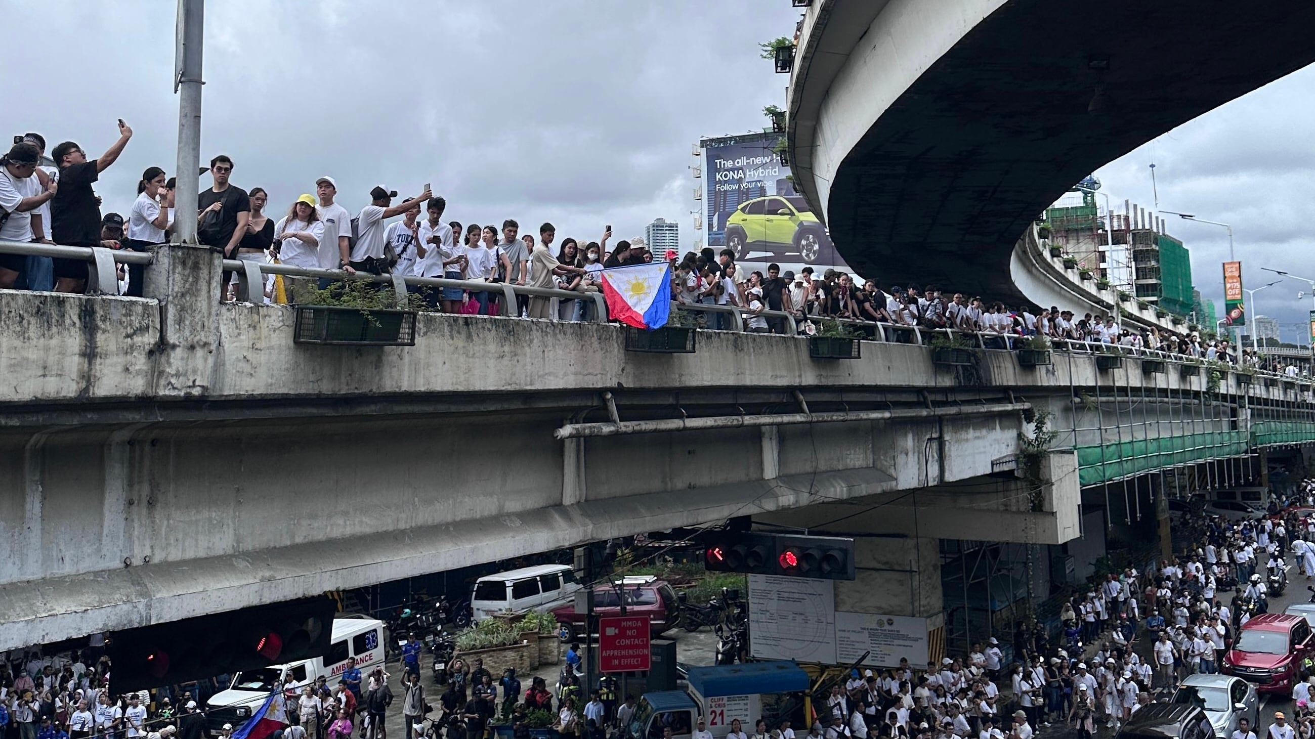 People gathering on a road protesting