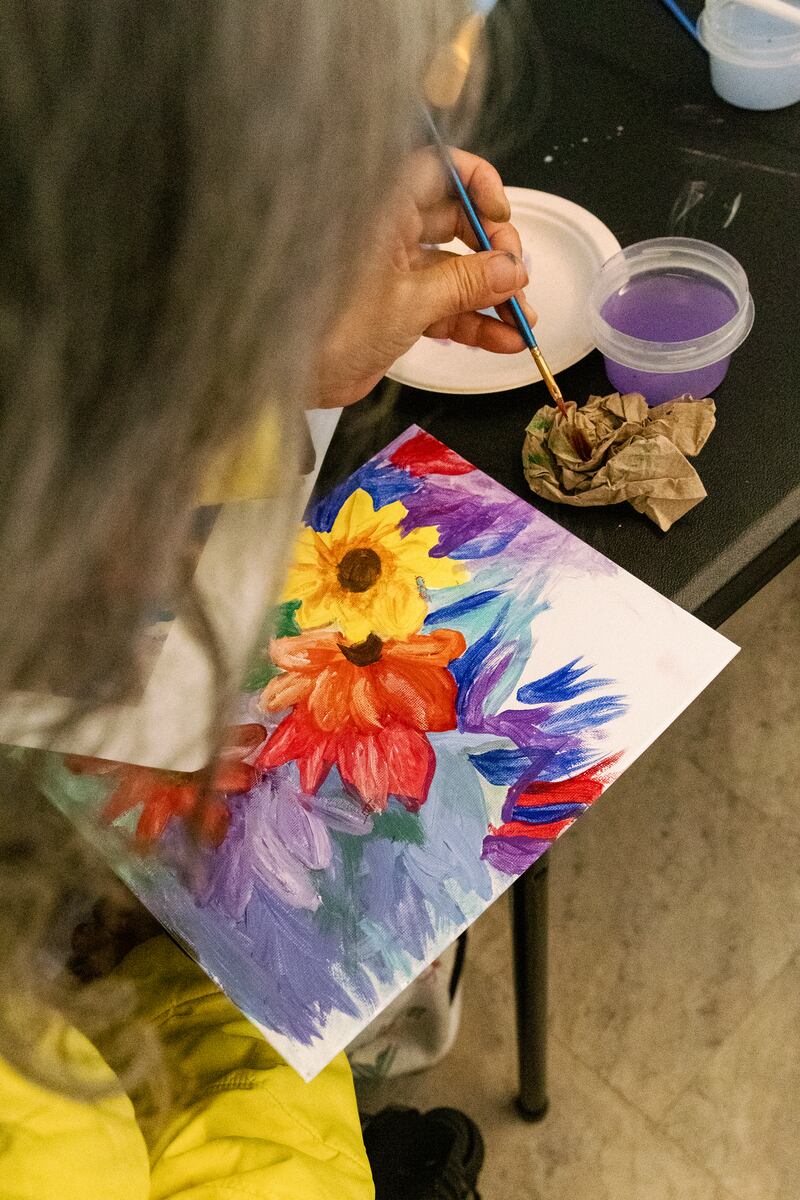 Leung-Astwood works on a painting during a watercolor class at the Wallis Annenberg GenSpace.