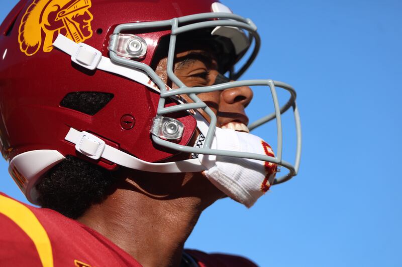 Ja'Kobi Lane side profile. He wears a cardinal USC football helmet with gold accents.