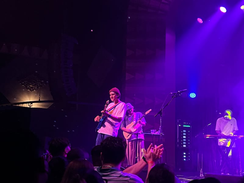 DESCRIBE THE IMAGE FOR ACCESSIBILITY, EXAMPLE: Photo of a chef putting red sauce onto an omelette.
