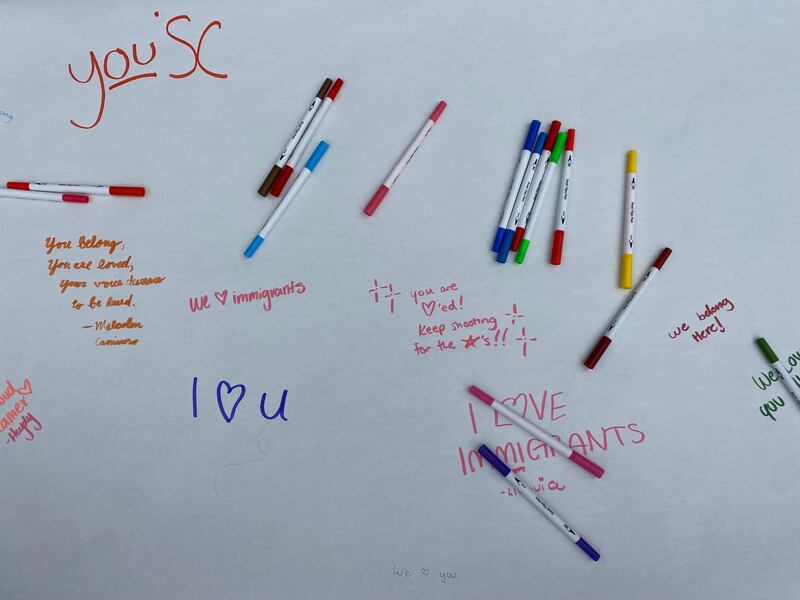 Messages for the undocumented community at USC are pictured on a piece of paper.