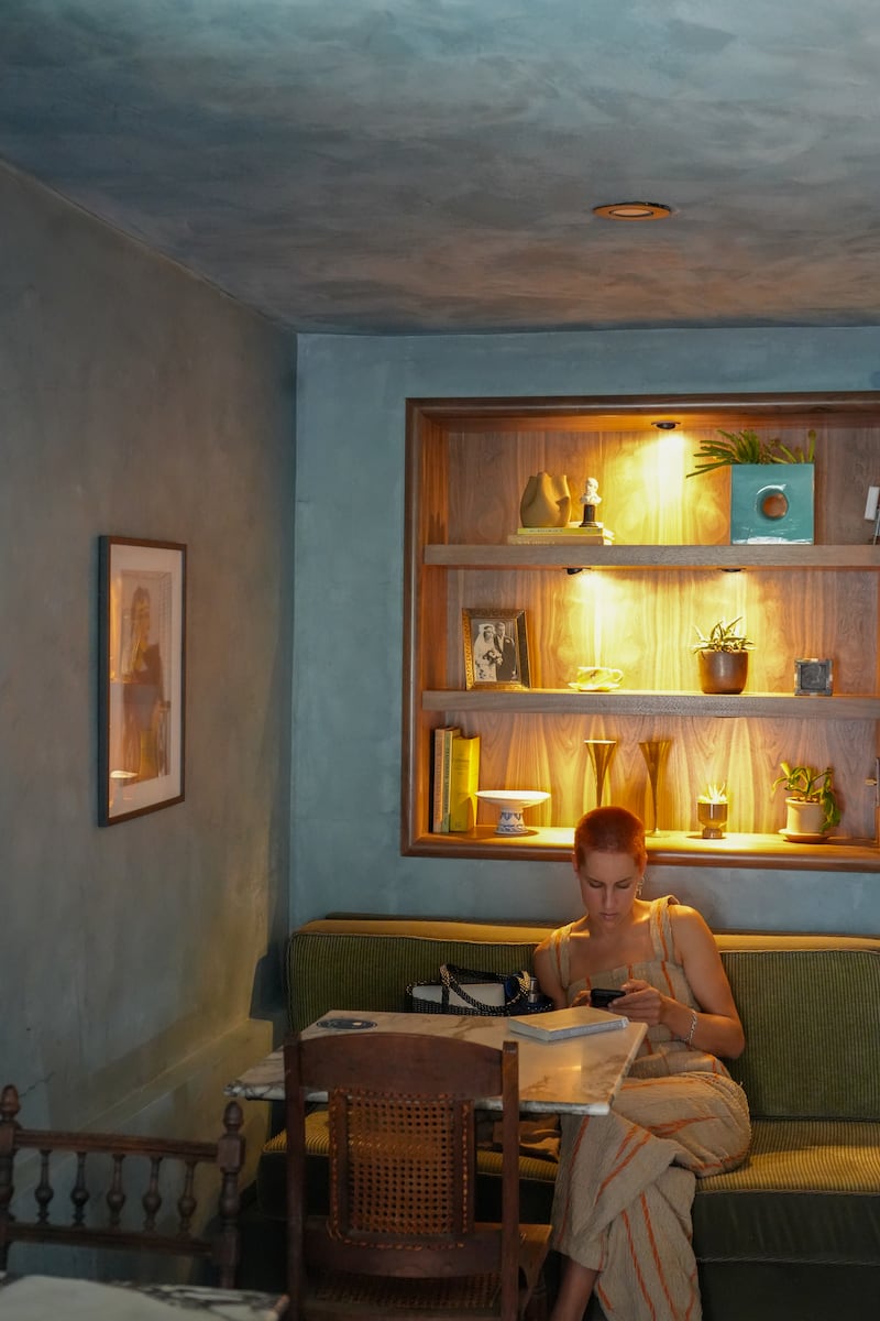 Photo of a woman on her phone.