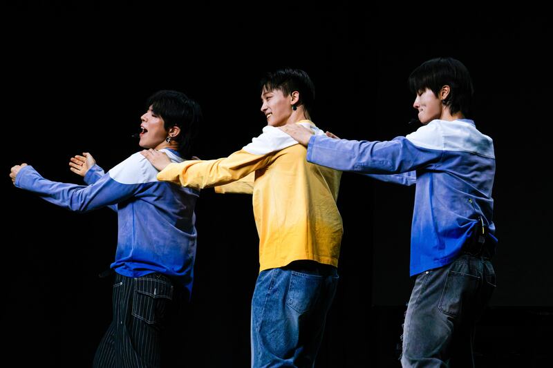 K-pop artists dancing on stage