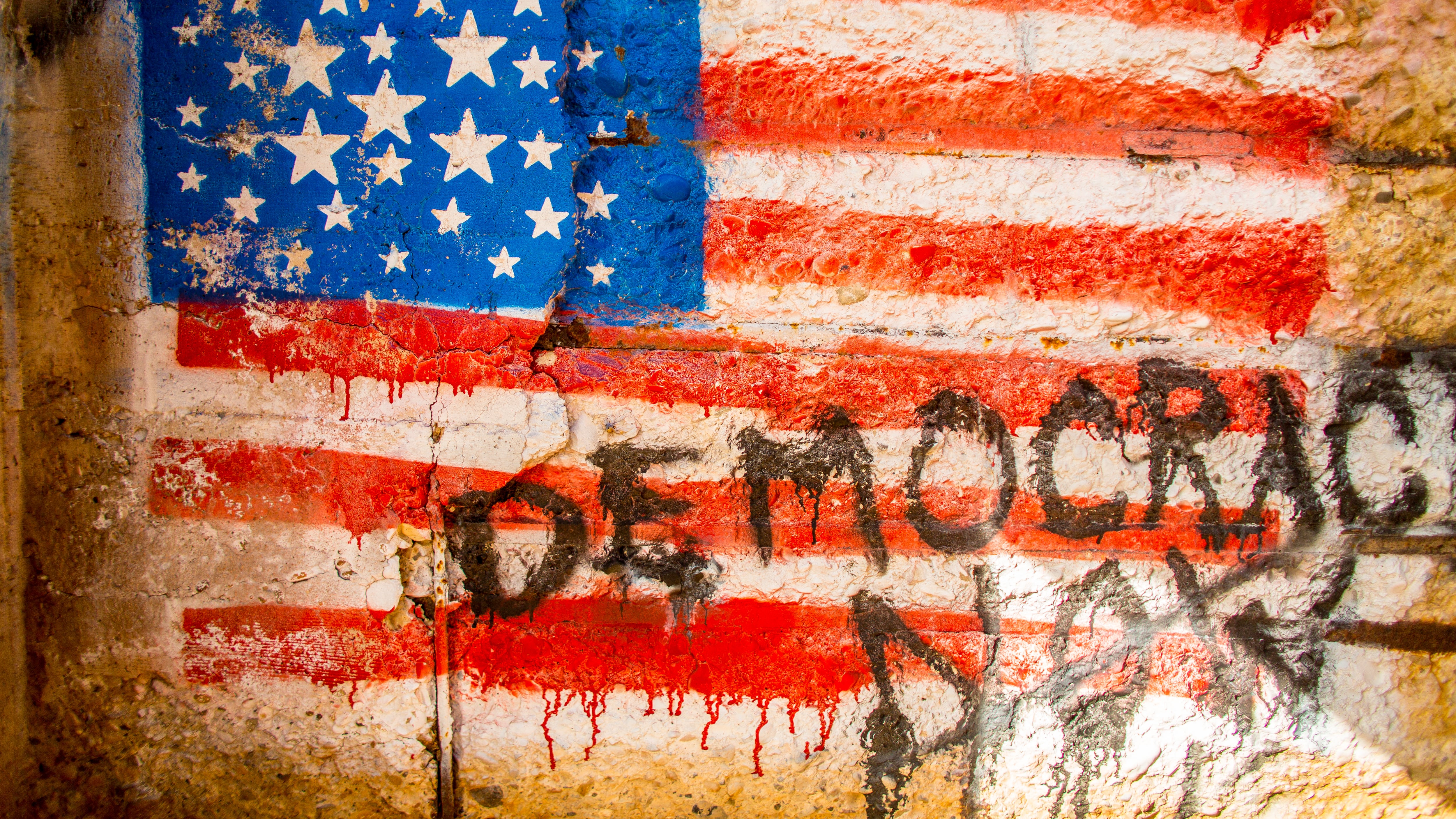 Photo of the American flag with graffiti