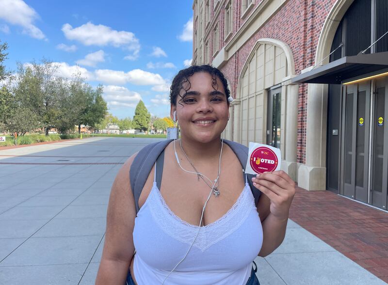 Grubbs smiling and posing with her USC "I Voted" sticker.