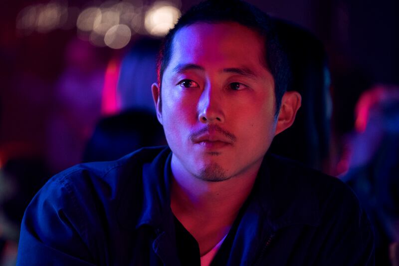 Still of a man with red and blue lights