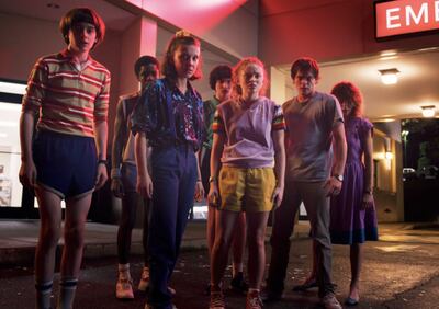 [The cast of 'Stranger Things' stands facing their demons in Star Court Mall.]