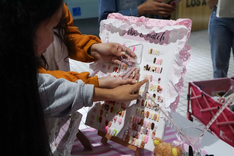 People looking at press-on nails