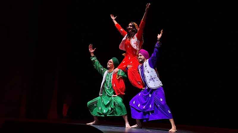 The performers invigorate the audience with the lively folk dance of the state of Punjab in India.
