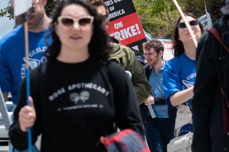 John Cochran, a TV writer for the last decade and previous Survivor contestant and winner was out with other protesters showing his support for the Writers Guild, of which he is a member.