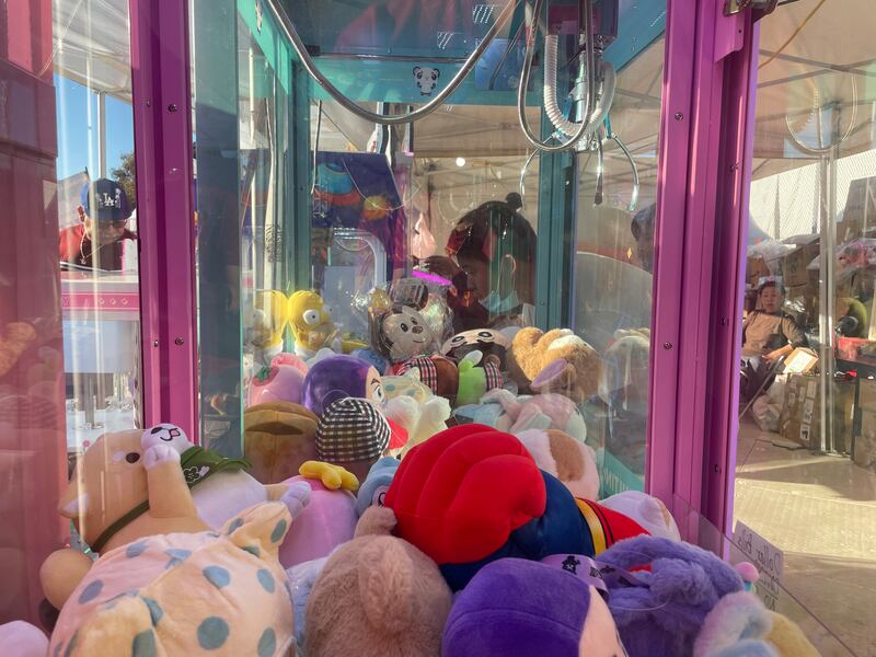 Photo of a claw machine full of stuffed toys