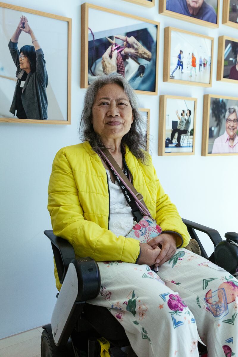 Leung-Astwood sits in the hallway of the Wallis Annenberg GenSpace, an innovative senior center located in Koreatown.