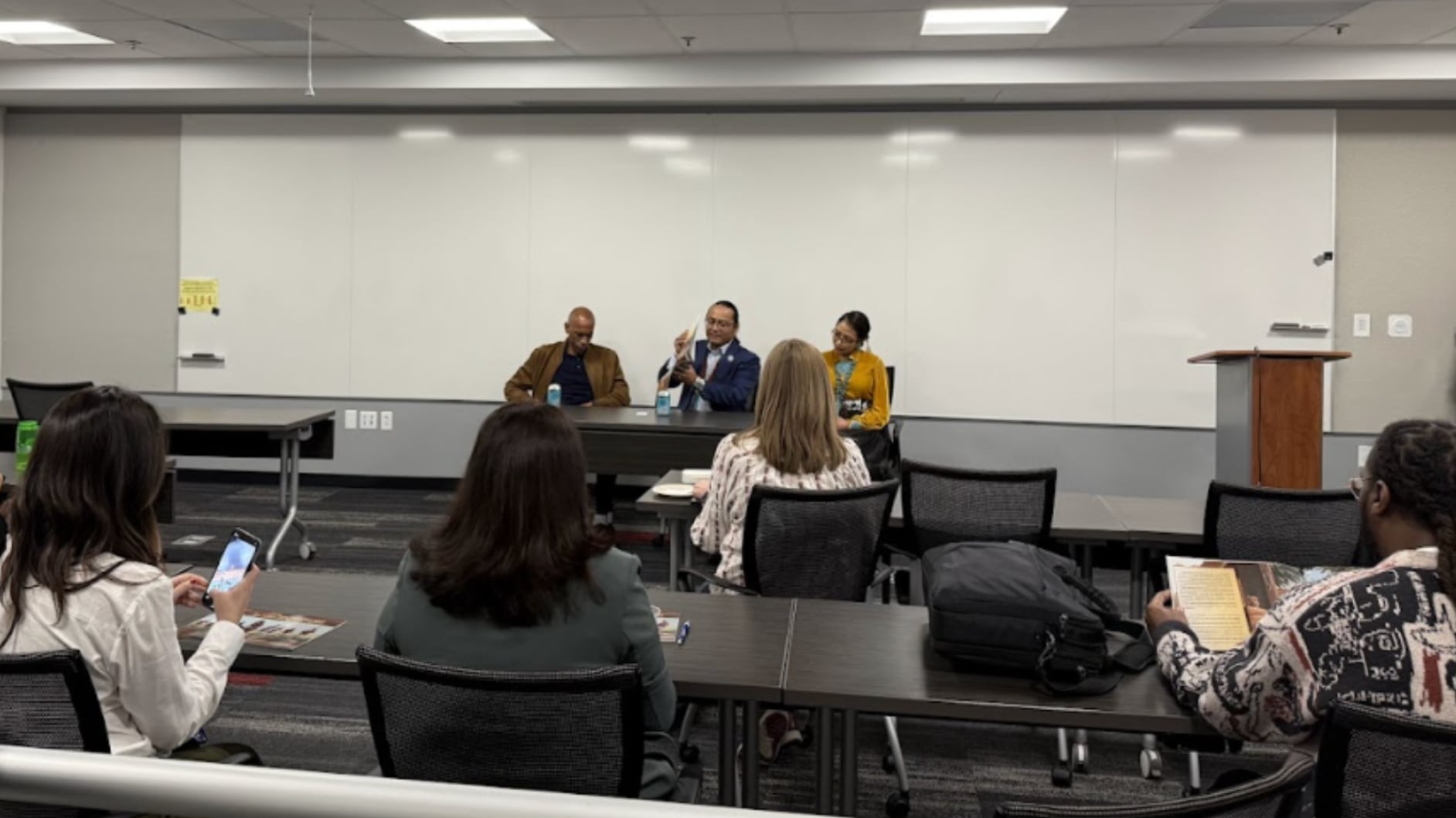 Dean Pedro Noruega, Dr. Buu Van Nygren and Jasmine Blackwater-Nygren lead a book club discussion.
