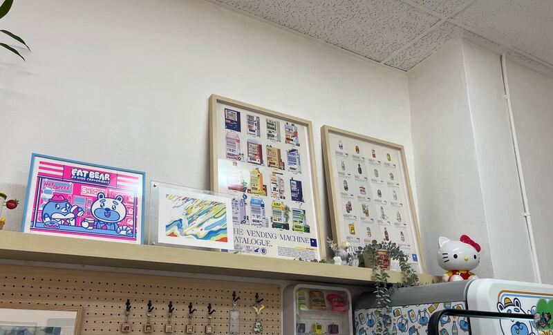 Photo of a shelf with four framed images