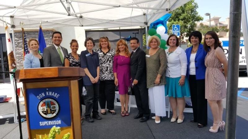 A photo of Daniela at a community clinic opening