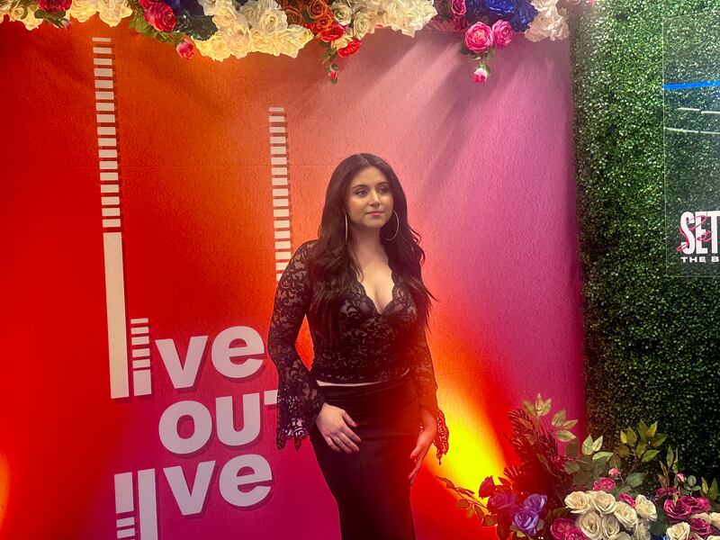 DESCRIBE THE IMAGE FOR ACCESSIBILITY, EXAMPLE: Photo of a chef putting red sauce onto an omelette.