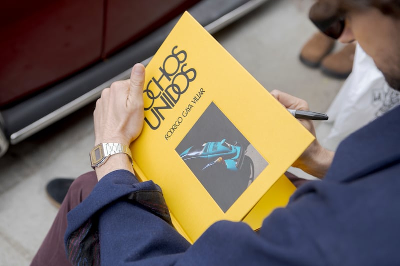 Guy signing a book