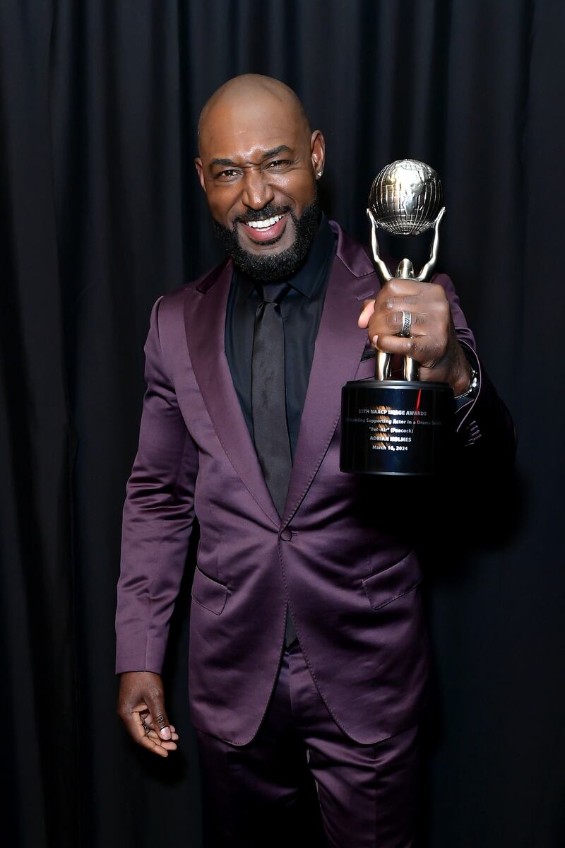 Adrian Holmes holding his NAACP Image Award. Photo Courtesy of (Getty Images for NAACP)