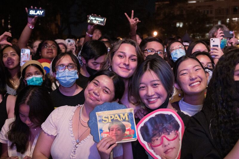 Sophomore Audrey Ma (third from right) holds a face cutout of Mujin and a can of spam with leader Dann's face on it. (Photo by Michael Chow)