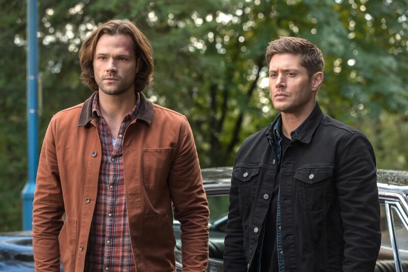 A photo of 2 actors from Supernatural looking off camera.