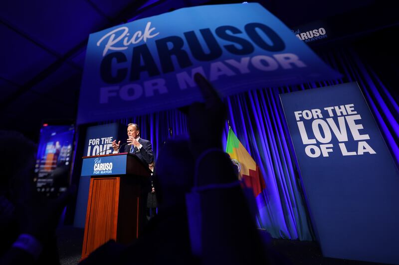 Caruso speaks to a crowd of supporters as they chant, “Rick, Rick, Rick!”