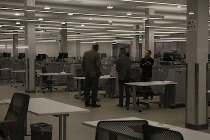 Three men meet in the ‘tally room’ of the facility where ballots will be counted.