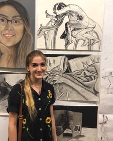 Photo of Aydin with her artwork.
